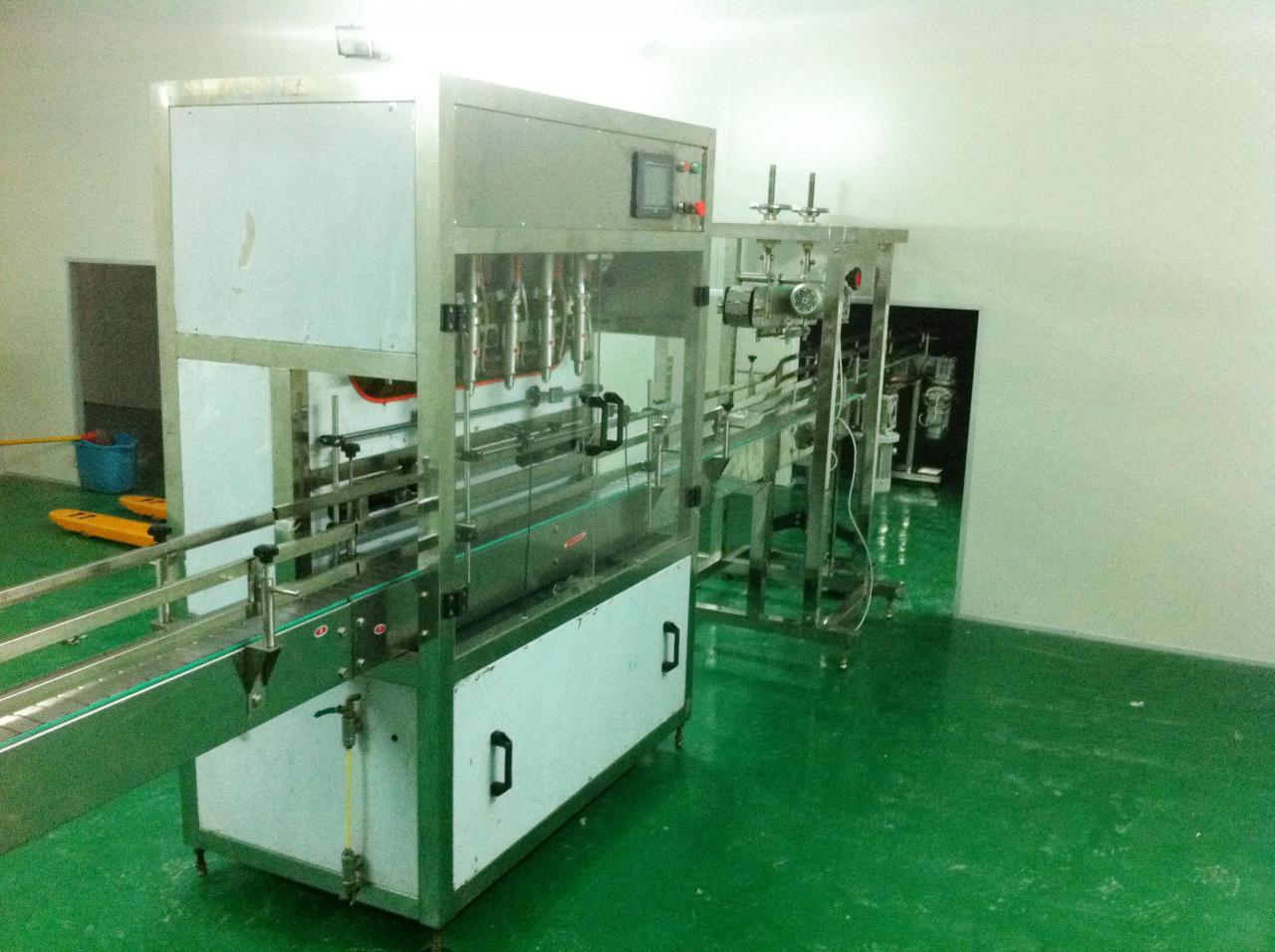 Linear filling machine with 4 filling heads லீனியர் ஃபில்லிங் மெஷின்.jpg