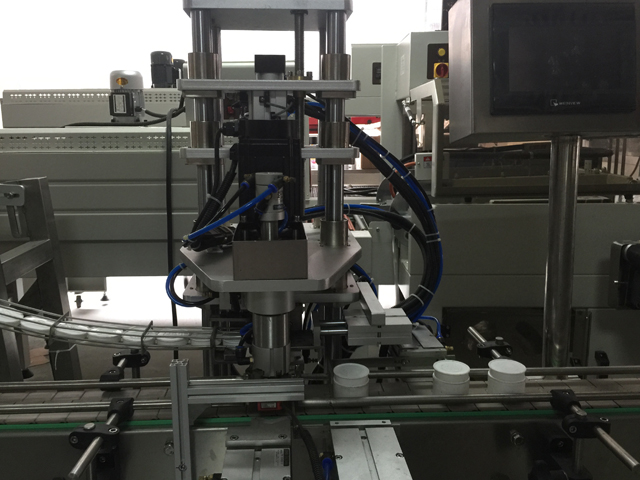 ஜாடிகளை சீல் செய்யும் இயந்திரம்.jpg