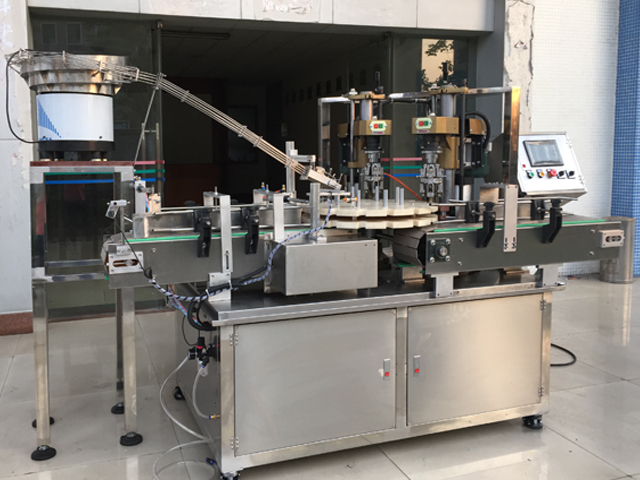 capping machine with 2 capping heads ஸ்க்ரூ கேப்பர் உபகரணங்கள் semi automatic.jpg