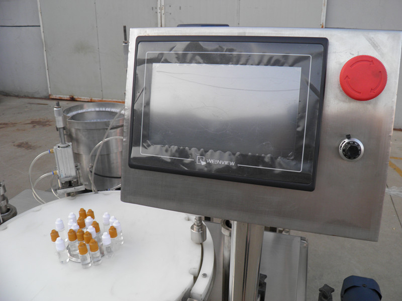 filling plugging capping labeling production line E திரவ PLC பாட்டில் நிரப்பு மூடுதல் labeling.jpg