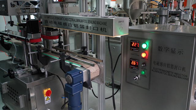 aluminum induction foil sealing machine சீல் இயந்திரம் automatic.jpg