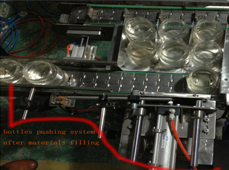 automatic bottles pushing system after filing பாட்டில் தள்ளும் அமைப்பு.jpg